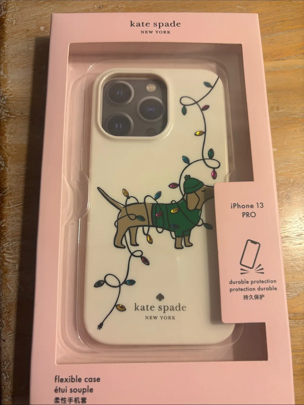 kate spade Cream iPhone 13 Pro Case with Dachshund and Multicolor Holiday Lights